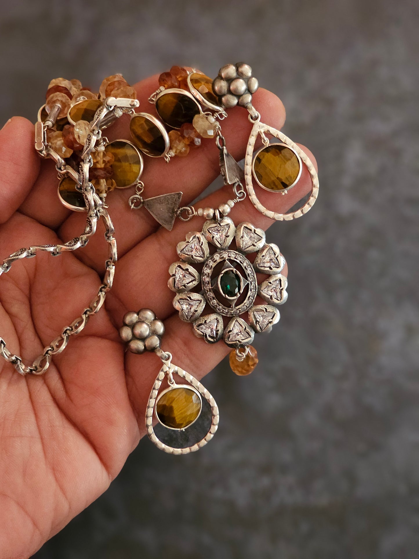 Tiger eye strung with hessonite stones strung on silver wires with Victorian setting moissanite pendant