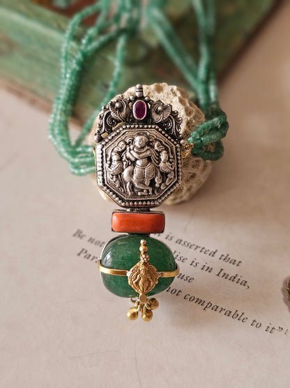 Vintage silver nakas pendant with emerald tumble and strings