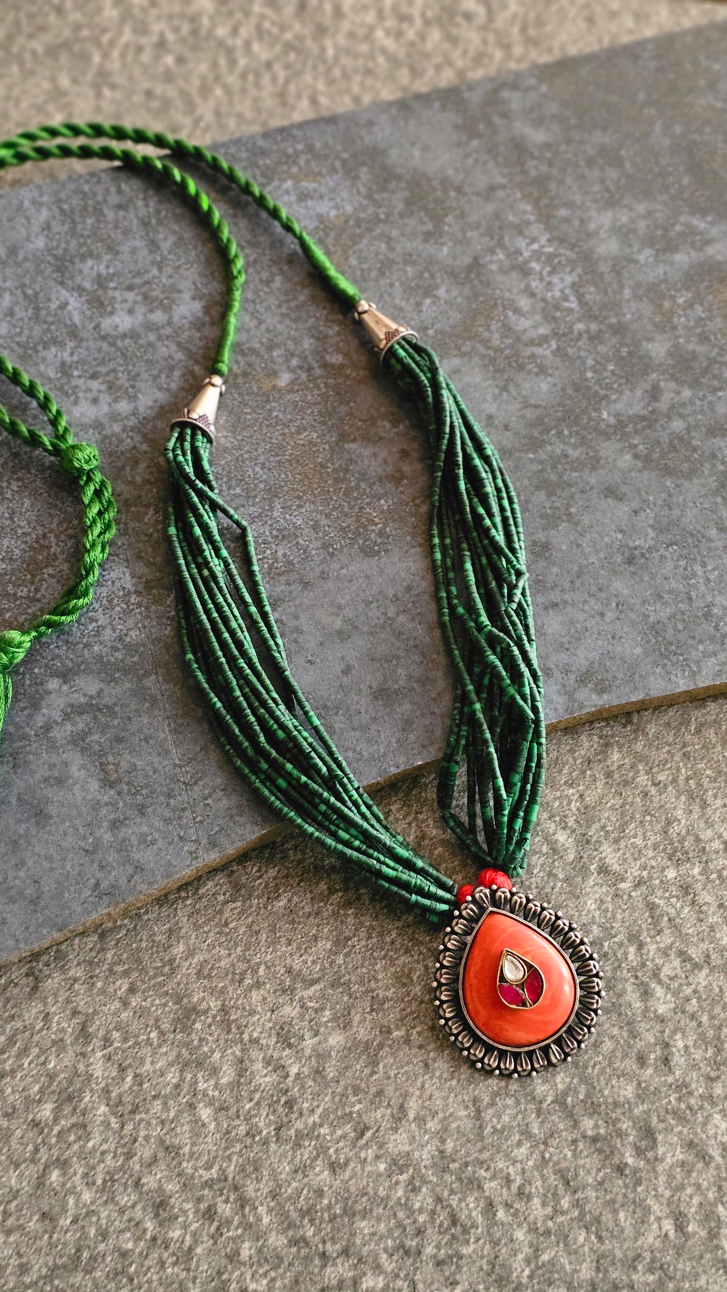 Malachite strings necklace with coral kundan pendant
