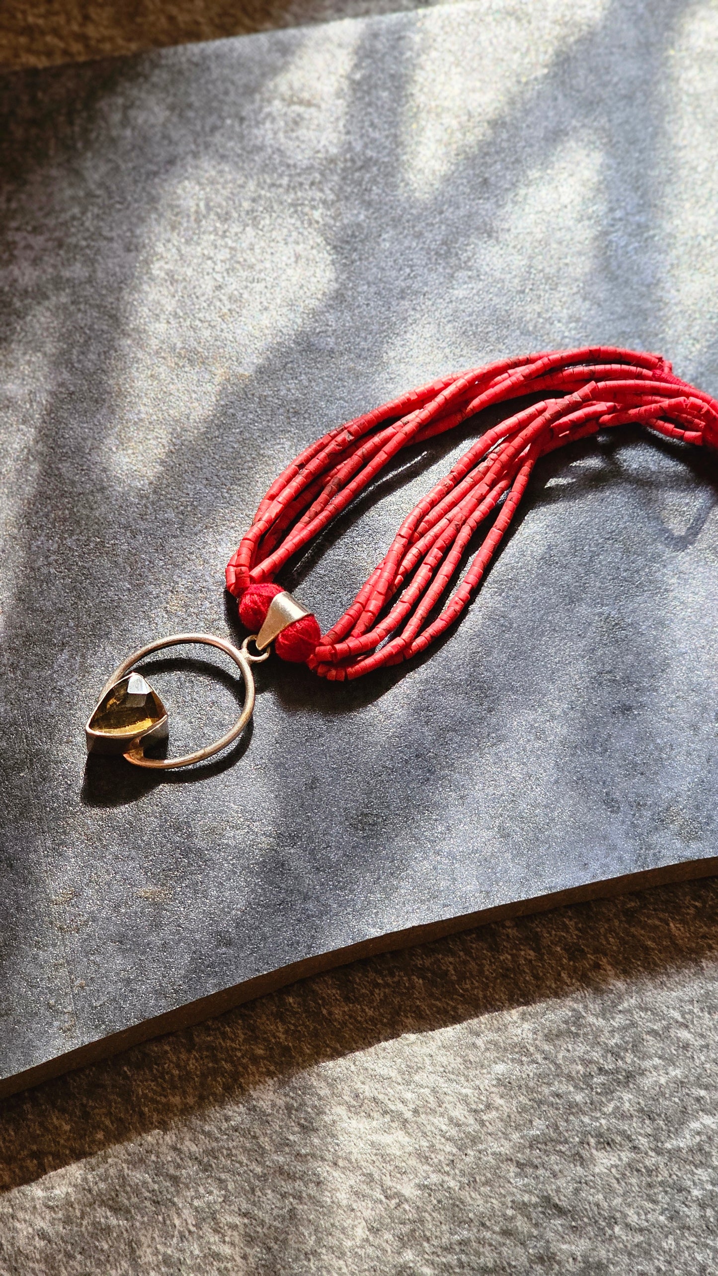 Red coral strings with yellow topaz
