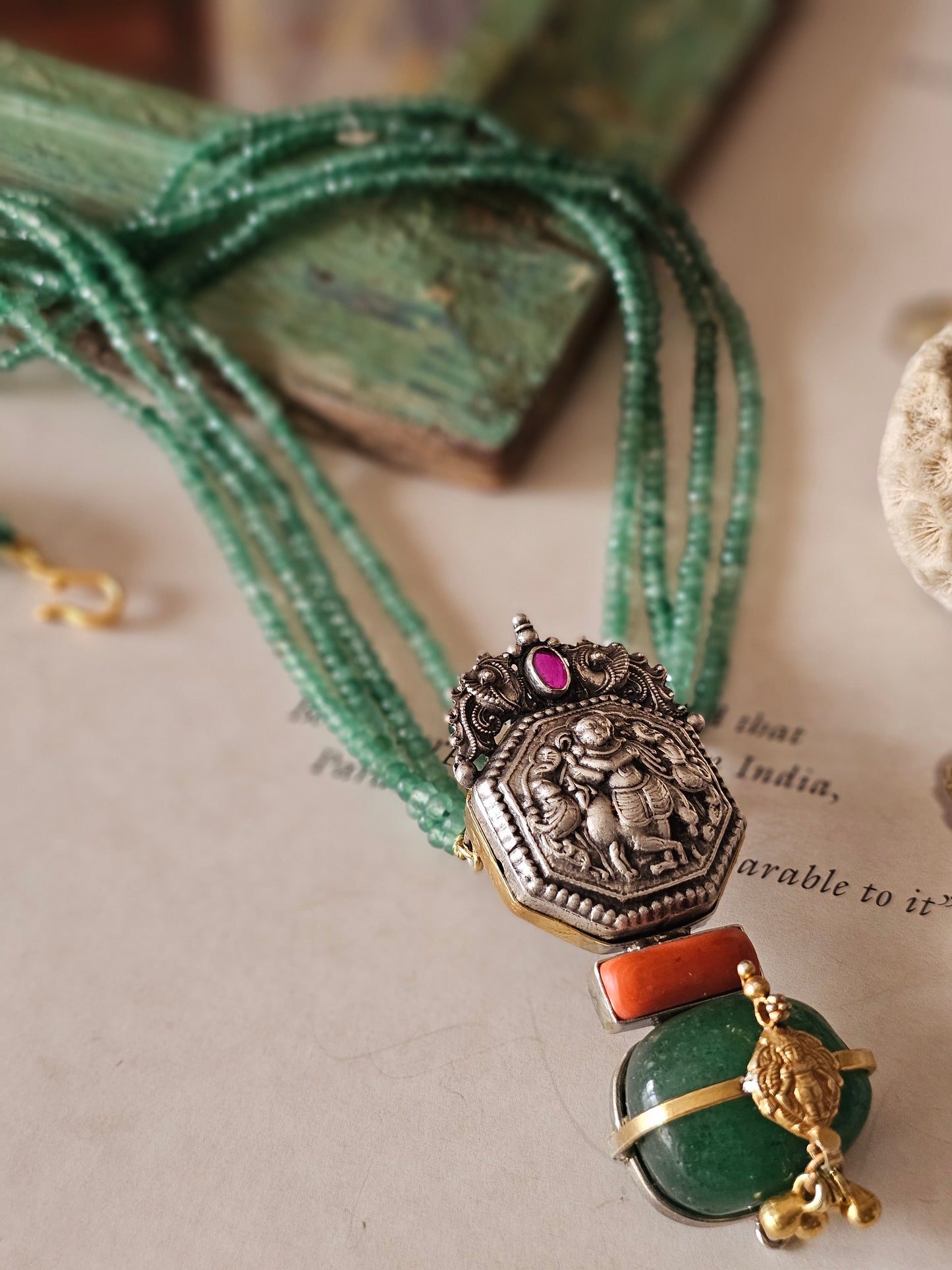 Vintage silver nakas pendant with emerald tumble and strings