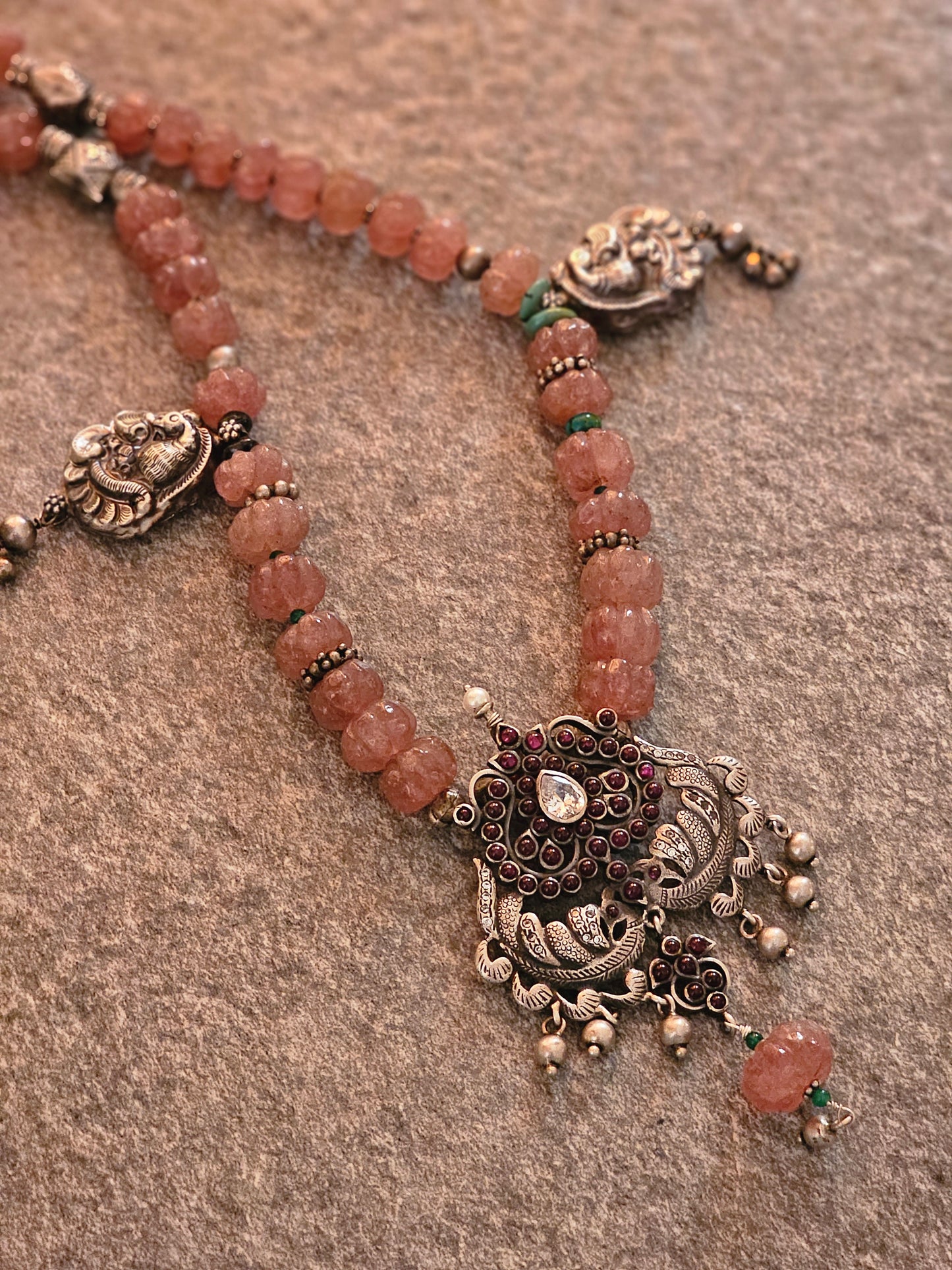 Kempu nakash-style peacock pendant with pink jade strawberry gemstones