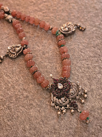 Kempu nakash-style peacock pendant with pink jade strawberry gemstones