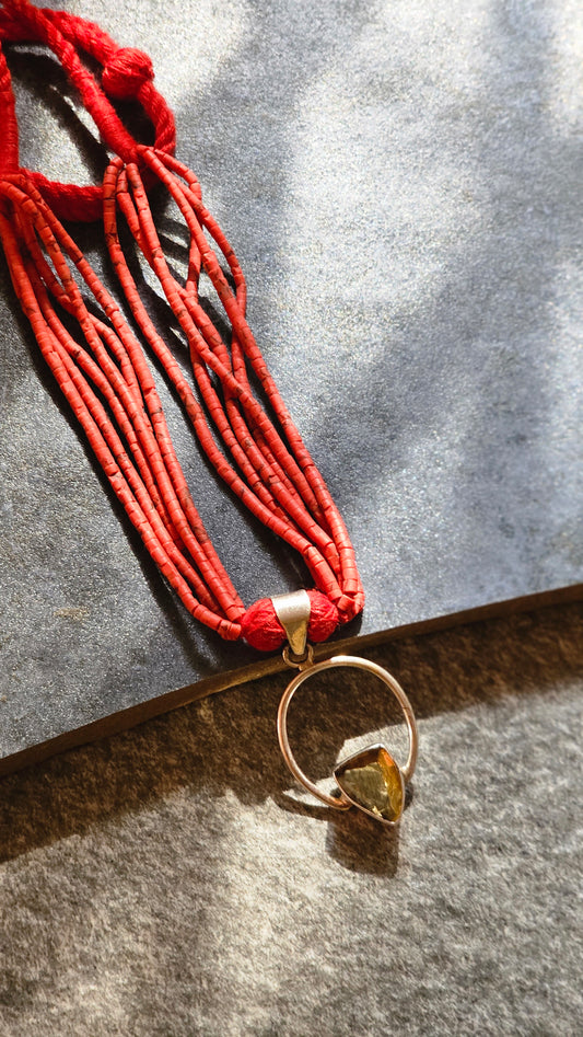 Red coral strings with yellow topaz