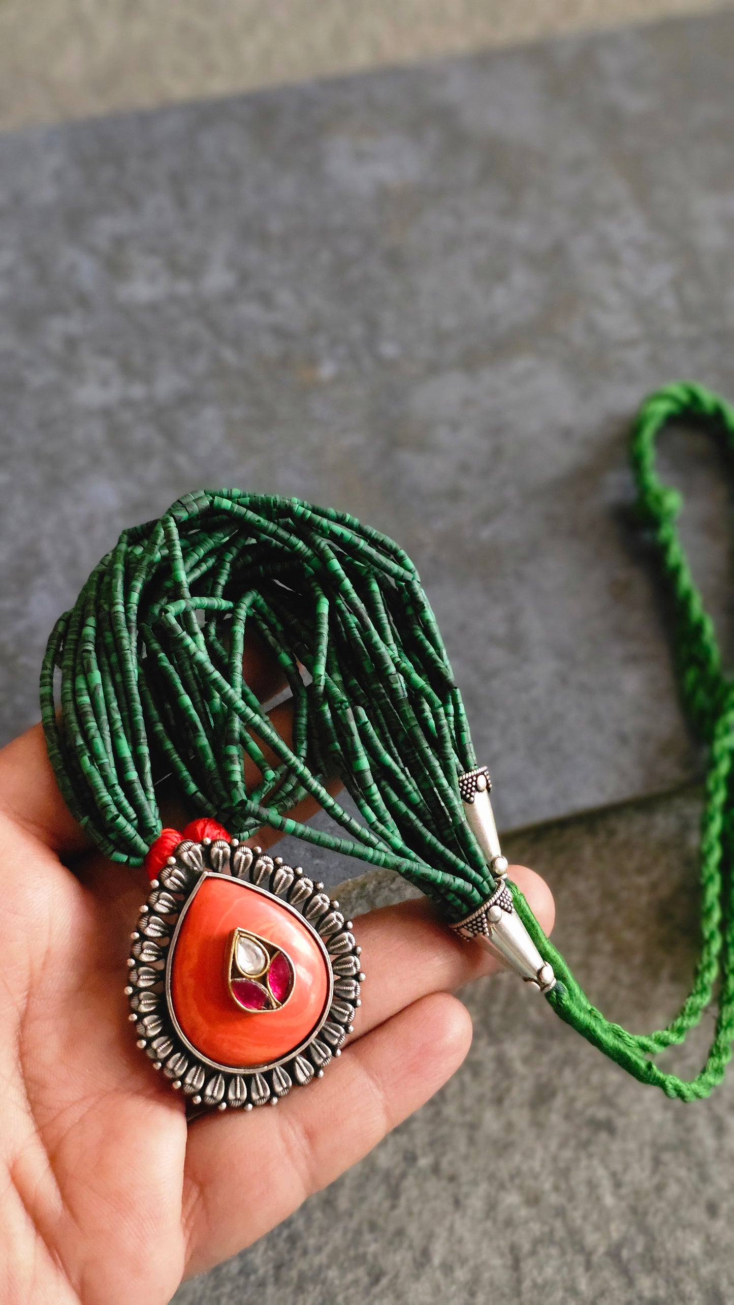 Malachite strings necklace with coral kundan pendant