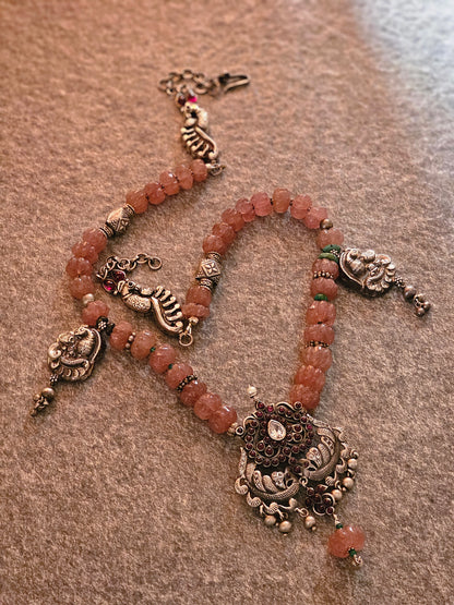 Kempu nakash-style peacock pendant with pink jade strawberry gemstones