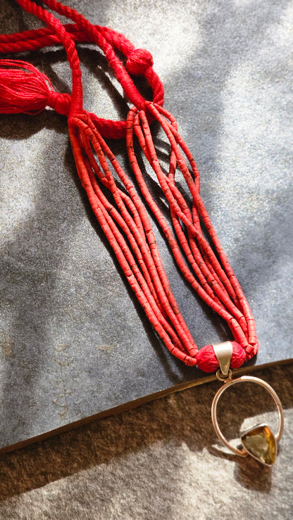 Red coral strings with yellow topaz